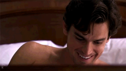 neal in bed laughing